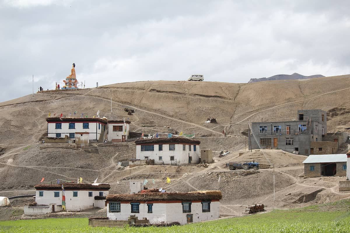 Langza village houses below its hilltop Buddha statue in Spiti